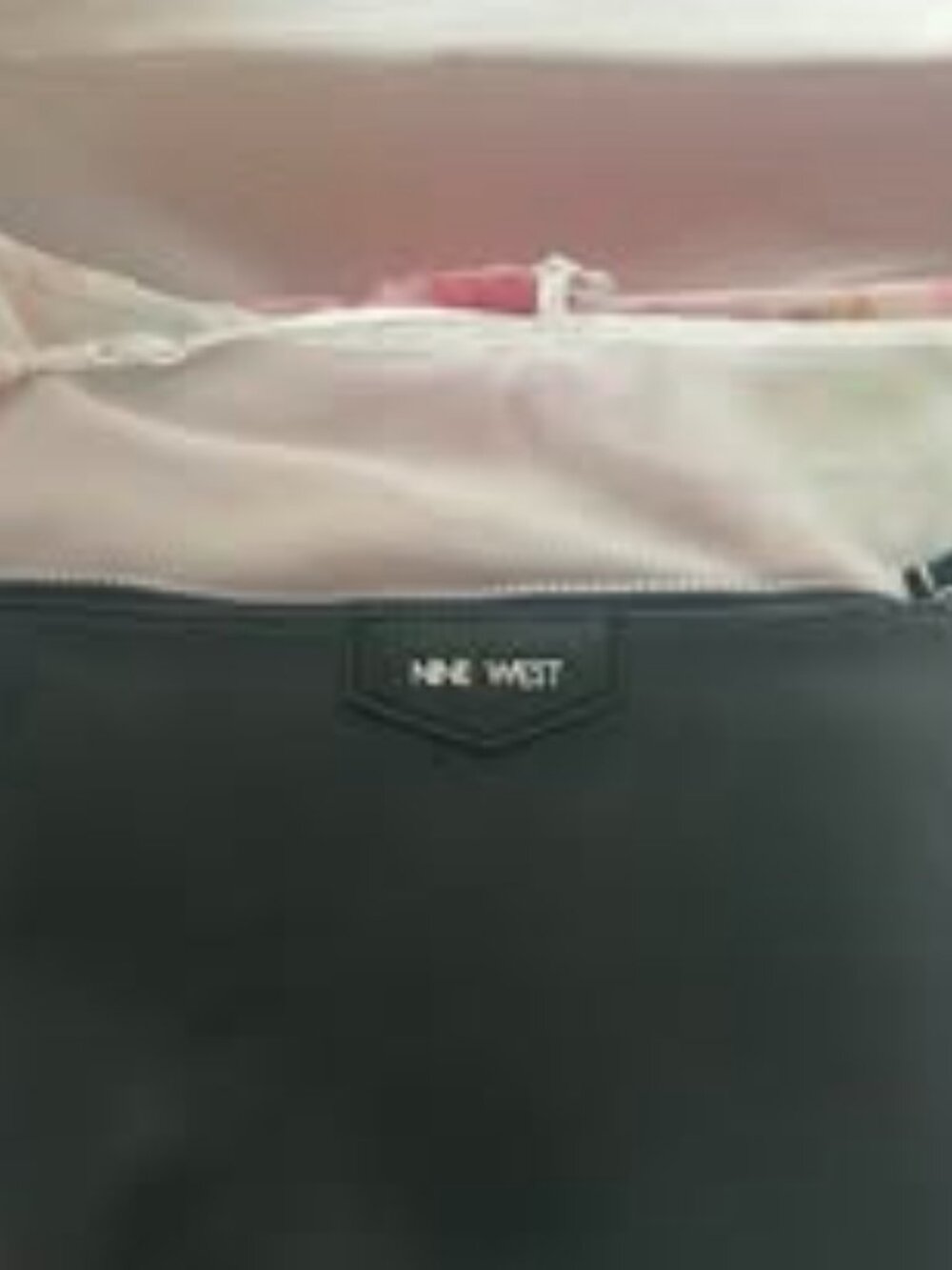 Nine West small black clutch w/short strap one zipper on inside pocket used once